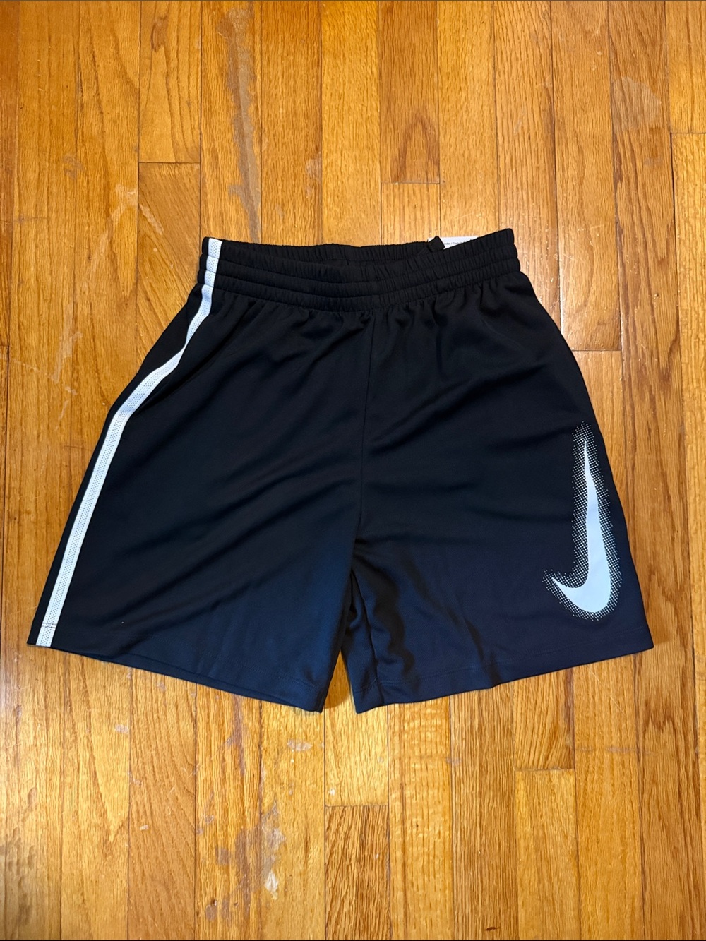 Nike Black Athletic Shorts with White Swoosh and Side Stripe